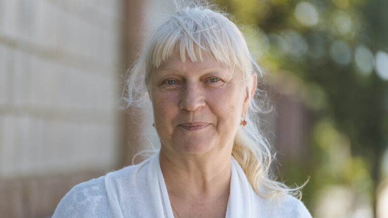 Portrait of a beautiful middle-aged woman outdoors.