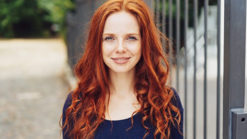 Pretty young woman with gorgeous long curly