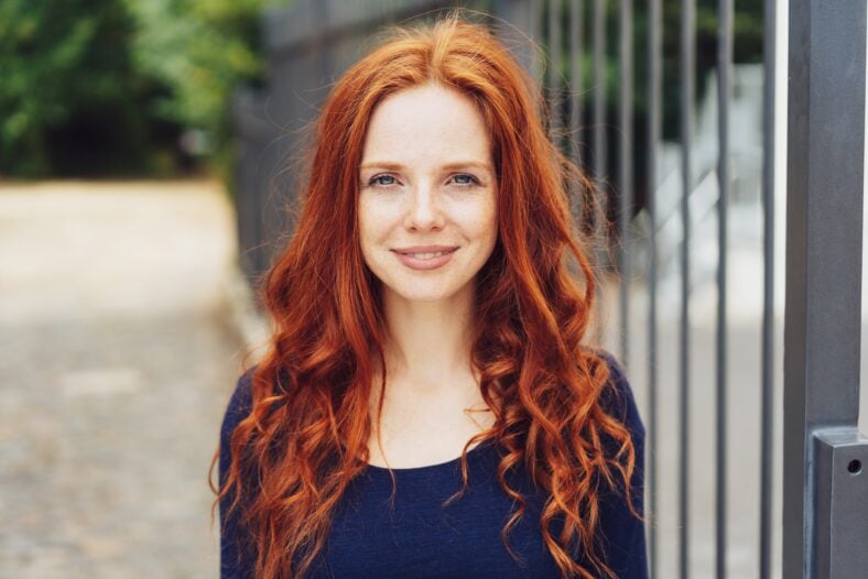 Pretty young woman with gorgeous long curly