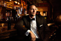 Man looking away while sitting at bar