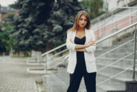 Stylish girl standing on a street. Lady