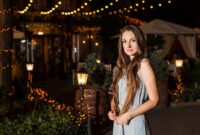 young attractive woman stands near the restaurant.