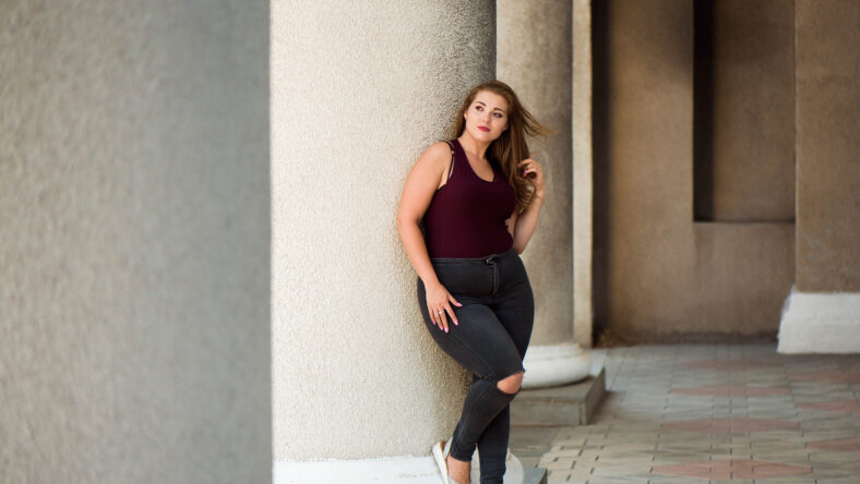 Young stylish woman walking on the city
