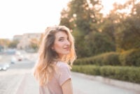 Beautiful young woman walking in the city.