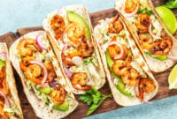 Shrimp tacos. Seafood fajitas with cabbage, onion,