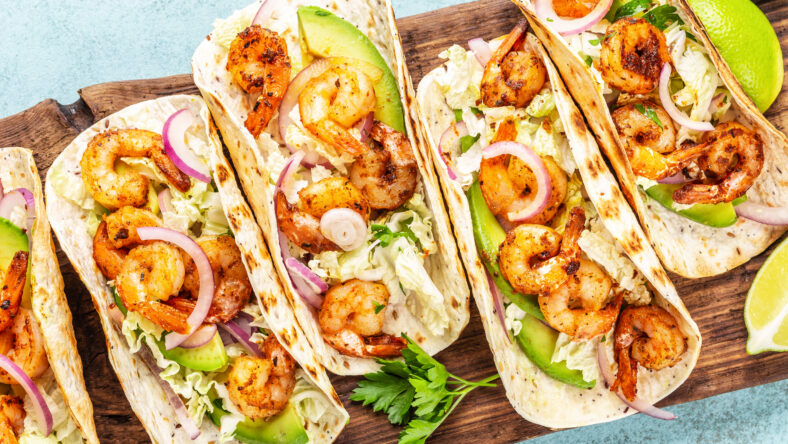 Shrimp tacos. Seafood fajitas with cabbage, onion,