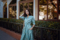 Fashion portrait of young stylish woman walking