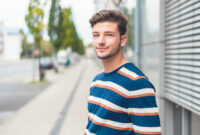 Portrait of young casual friendly man, selective