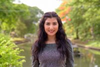 Portrait of young beautiful Indian woman relaxing