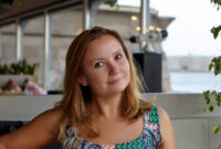 Summer. Cafe. Portrait of a young woman