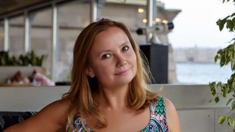 Summer. Cafe. Portrait of a young woman
