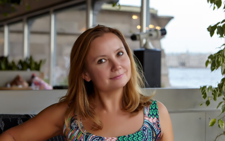 Summer. Cafe. Portrait of a young woman