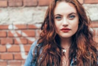 Fashion portrait of red curled long hair