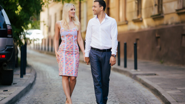 walking down the street together. Happy young