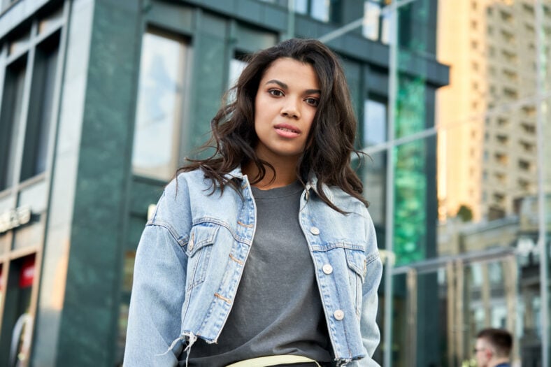Confident beautiful curly young hipster African American