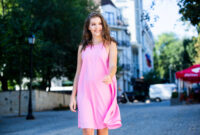 Beautiful european girl in summer dress walking