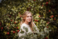 Natural outdoor portrait of blonde smiling woman