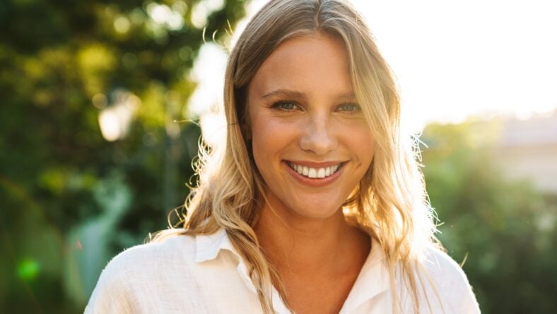 Beautiful happy woman smiling and looking at