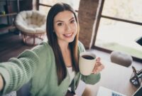 Portrait of optimistic girl doing selfie drink