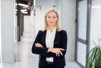 Indoor office portrait of pretty mature blond