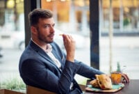 Confident businessman have a lunch in restaurant
