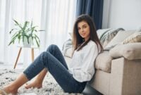Beautiful young woman in jeans and white