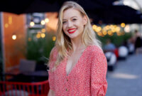 Happy young female in trendy dotted garment