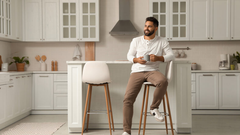 Handsome young man with cup of tea