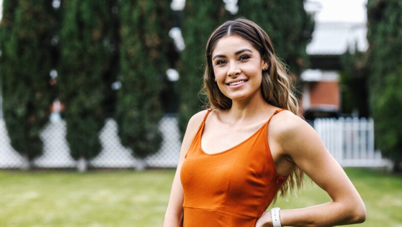 pretty brunette woman in an orange dress