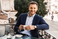 Handsome man with cup of coffee in