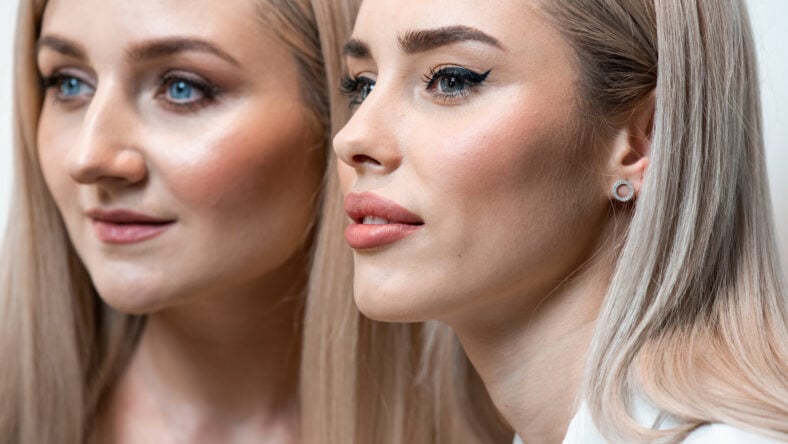 Two blonde women portrait in beauty salon