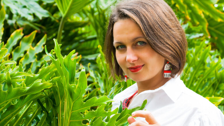 Beautiful woman with red lipstick and green