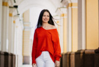 Satisfied young attractive brunette woman smiling looking