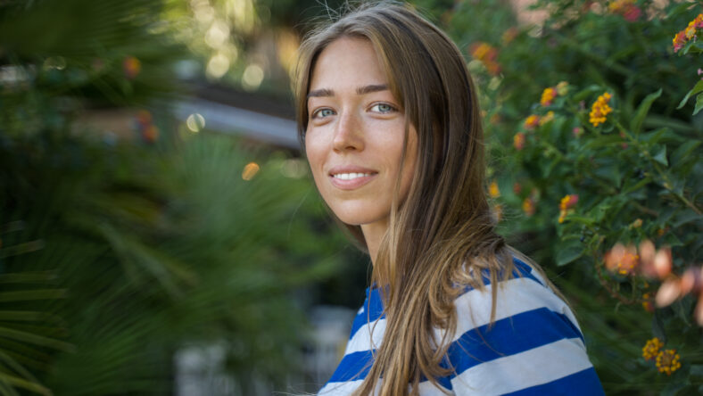 Portrait view of the tanned woman smiling