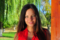outside portrait young beautiful woman lying on