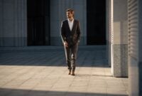 Elegant handsome man in classic suit standing
