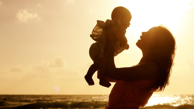 Portrait of happy loving mother and her