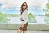 Outdoor portrait of happy young woman in