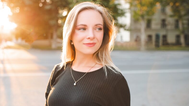 Smiling blonde woman 24-25 year old walking