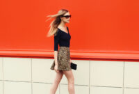 Beautiful stylish blonde young woman in leopard