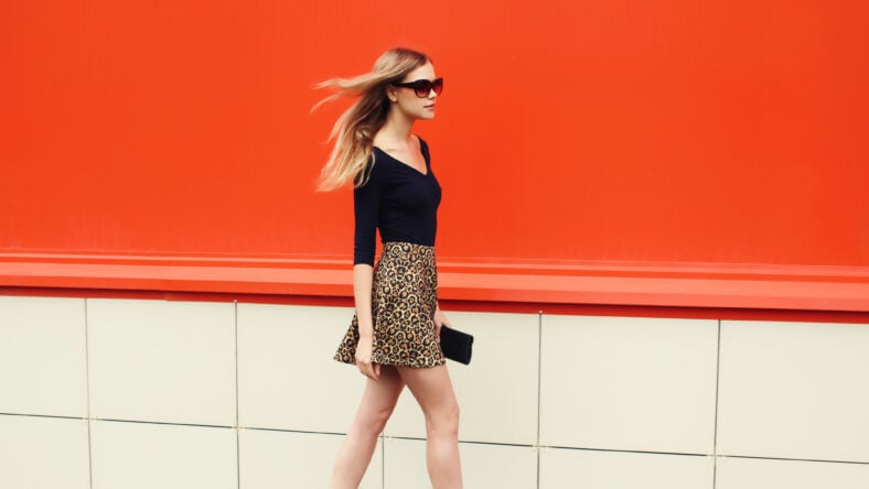 Beautiful stylish blonde young woman in leopard