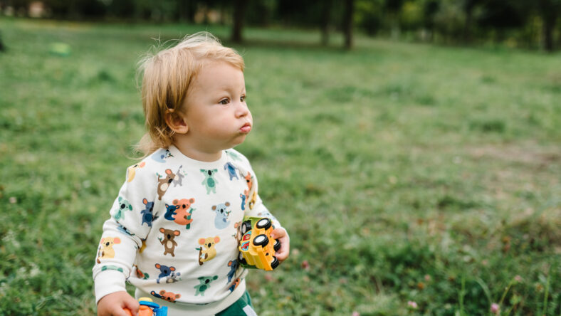 Toddler child little cute walking and playing