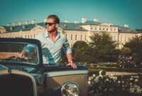 Confident wealthy young man with briefcase near