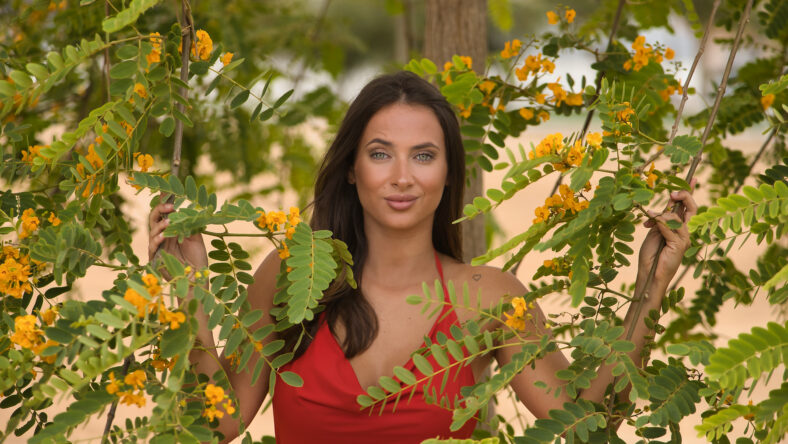 A beautiful young woman, with green eyes,